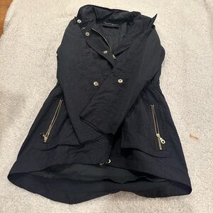 Black and gold rain jacket